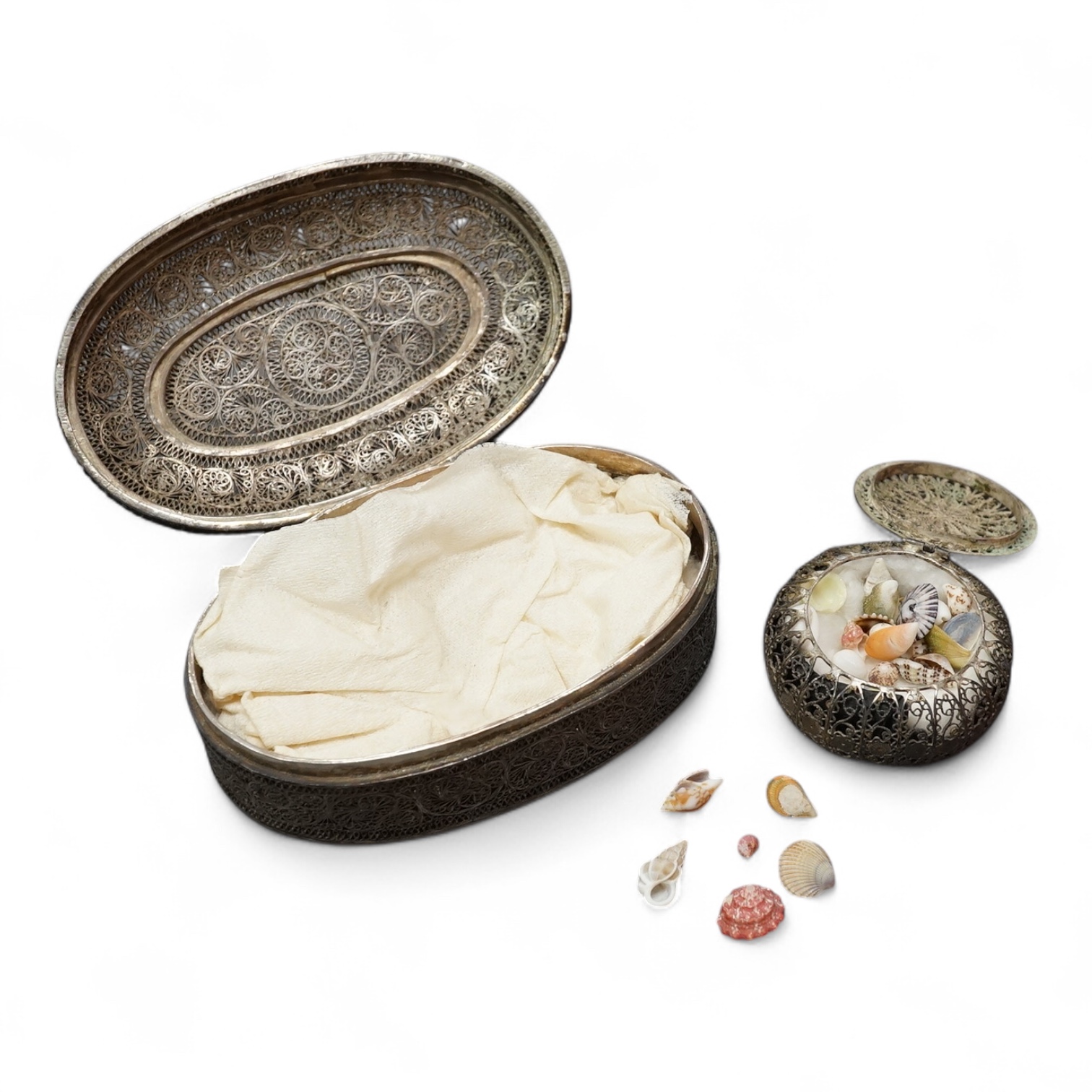 Two Indian filigree white metal boxes, the largest 95mm